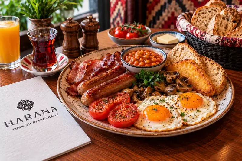 Full English breakfast with eggs, sausages, bacon, baked beans, mushrooms, tomatoes and toast
