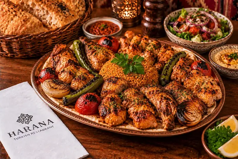 Harana chicken sharing platter with charcoal grilled chicken, bulgur, grilled vegetables and salad