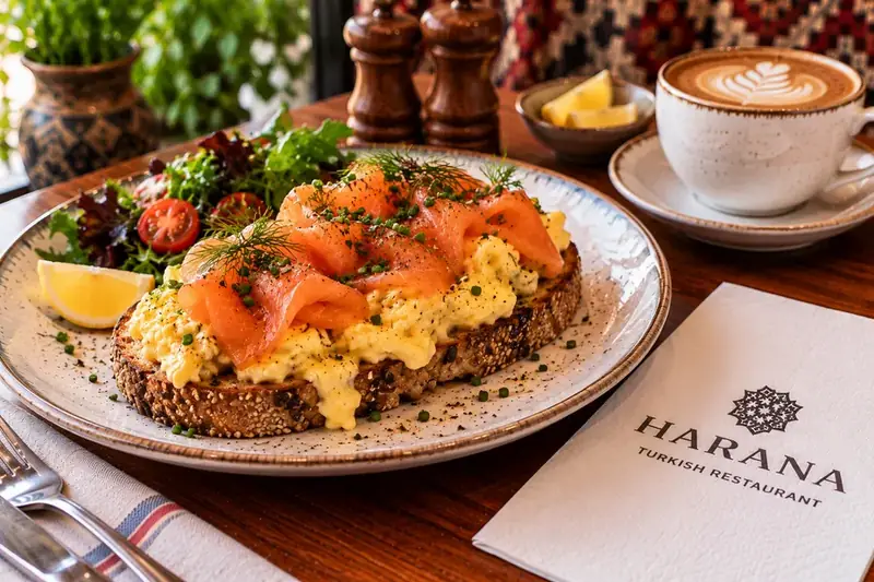Scrambled eggs and smoked salmon served on toasted bread